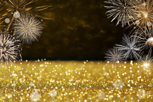 Golden glitter and bokeh background with fireworks