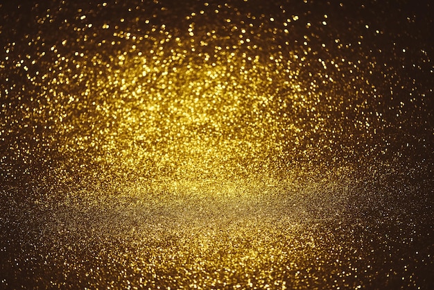 Photo golden glitter bokeh lighting texture blurred abstract background for birthday anniversary wedding new year eve or christmas