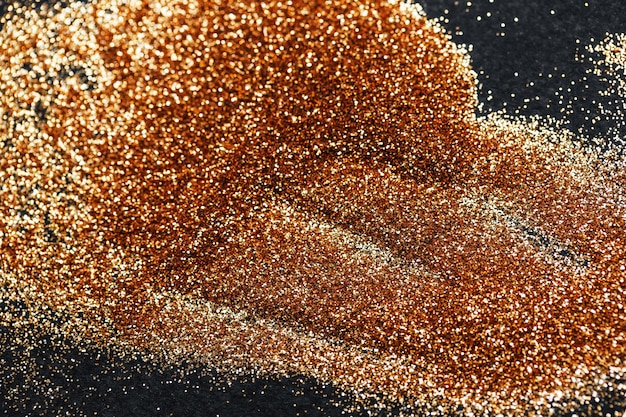 Glitter dorato è su sfondo nero