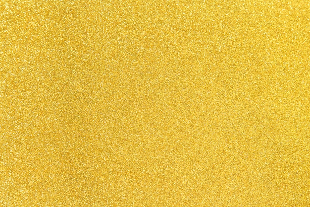 Golden glitter shiny texture background for christmas, celebration concept.