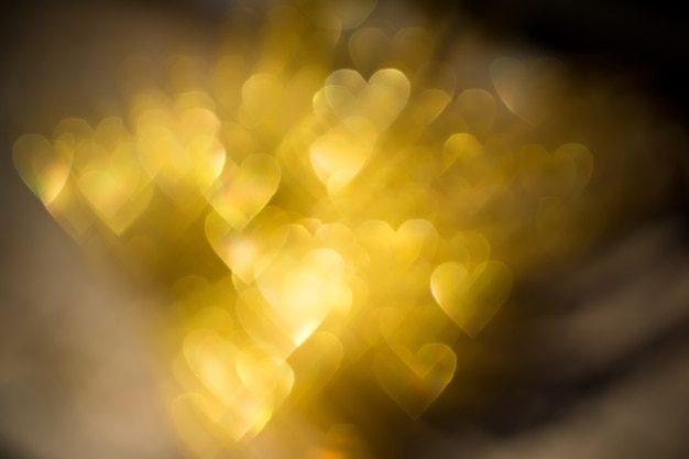 황금 심장 모양의 Bokeh