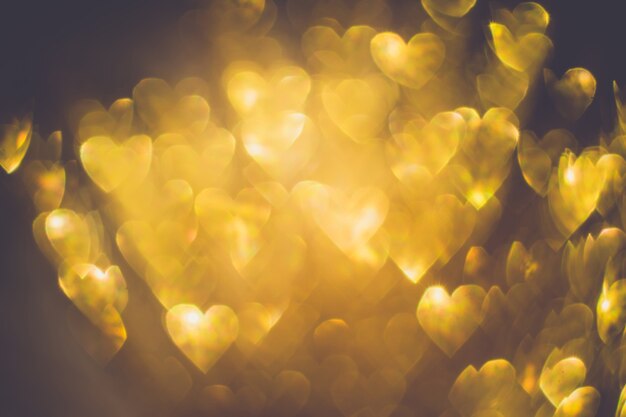 Photo golden heart shaped bokeh