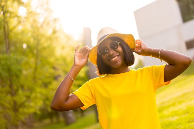 Golden hour a beautiful black woman basks in the warmth of summer in the forest