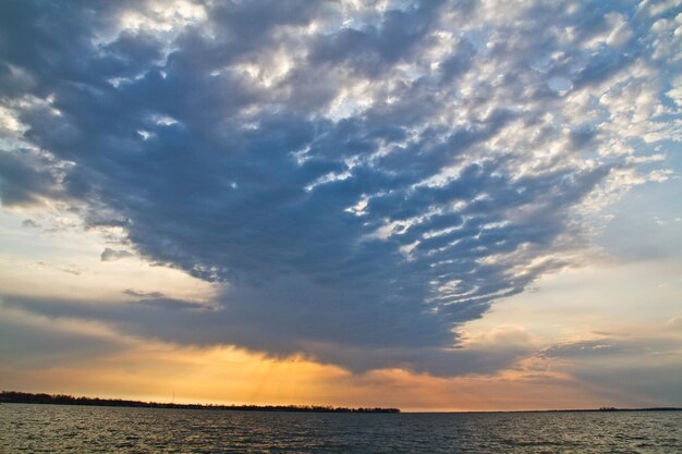 Golden Hour Inspirational Clouds Over Dream Like Water at Sunset