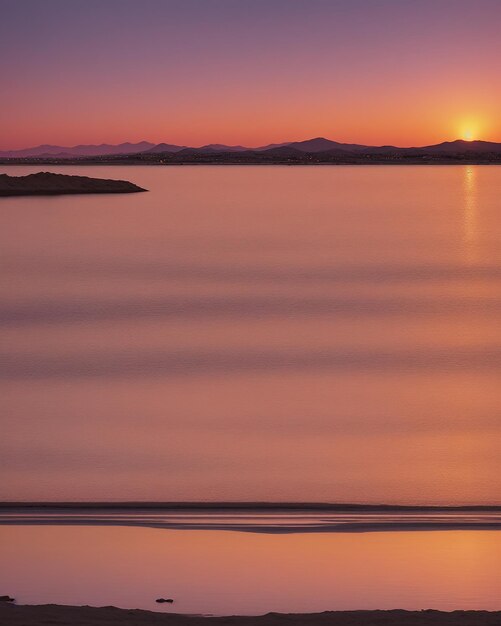 Photo golden hour pink orange and violet light sunset over the mar menor spaire flections on the water