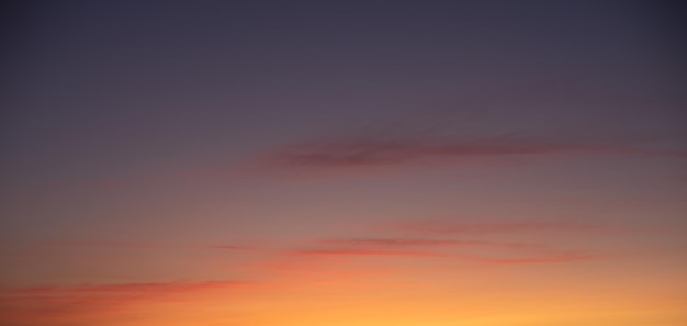 Golden hour sky with soft clouds