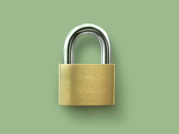 Golden key locked on green background concept security