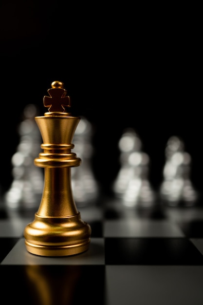 Premium Photo  Golden king chess standing in front of other chess