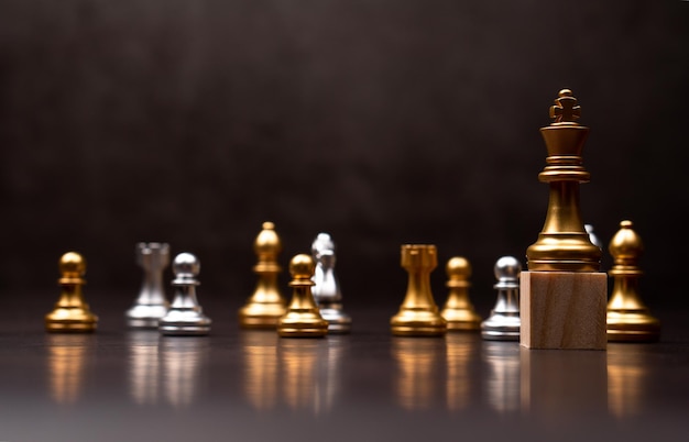 Golden king chess standing on a wooden stand The concept of Leaders in good organizations