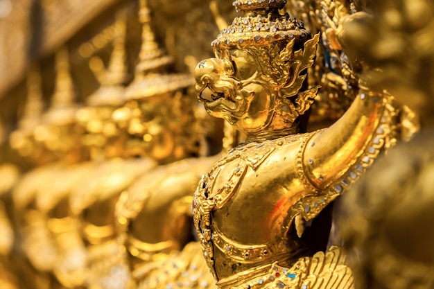 Golden Kinnari statue at Temple of Emerald Buddha (Wat Phra Kaew)