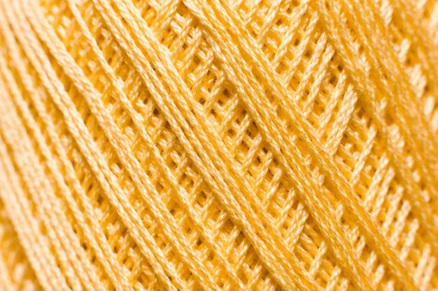 Golden knitting thread texture handiwork backdrop