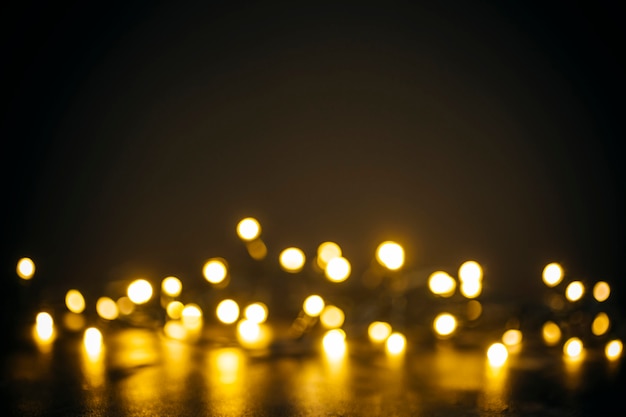 Golden lights in bokeh on a black background