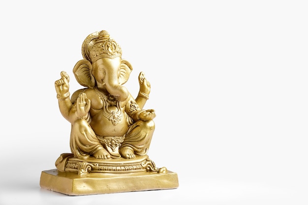 Golden lord ganesha sclupture over dark background. celebrate lord ganesha festival.