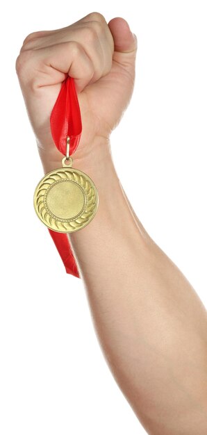 Golden medal in hand isolated on white