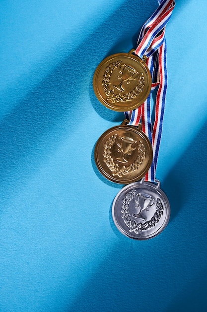 Golden medal on red background