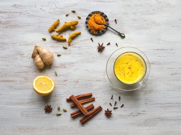 Golden milk with turmeric, cinnamon, ginger, lemon and pepper