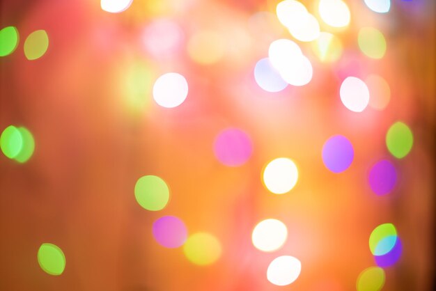 Golden and multicolored bokeh circle background for Christmas and happy new year with space to display messages