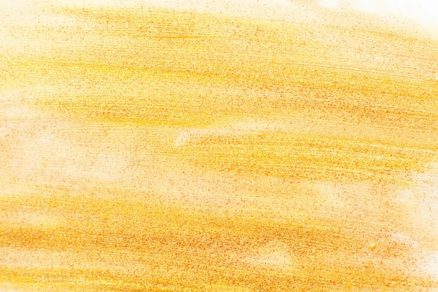 Golden nail polish texture free space. Yellow smears background