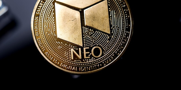 Golden Neo cryptocurrency Coin Golden on dark black backround with ice cubes