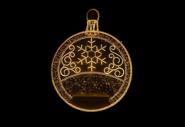 Golden New Years ball on a black background