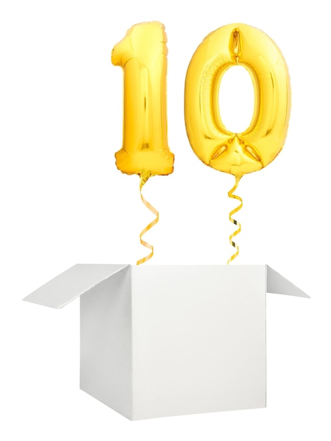 Golden number ten balloon flying out of blank white box isolated on white background