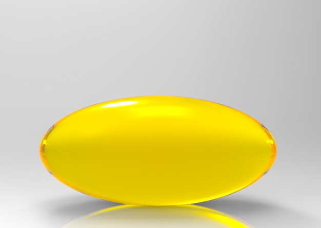 Golden omega 3 pill from cod fish on gray space background.