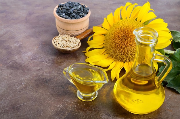 Golden organic oil in a small glass jug sunflower sunflower seeds Agriculture oil production