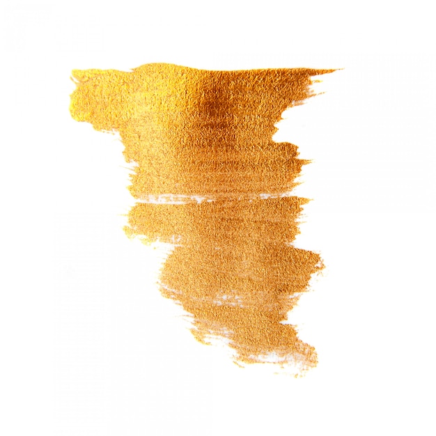 Golden painted brush texture background. Shining gold acrylic stain isolated 