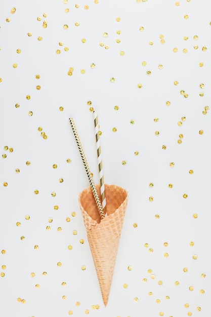 Golden party straws in waffle cone