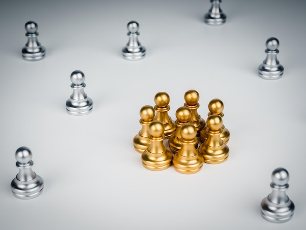 The golden pawn chess piece group standing in the middle of\
silver pawn chess pieces on white background stand out from the\
crowd human resources leadership unique concept