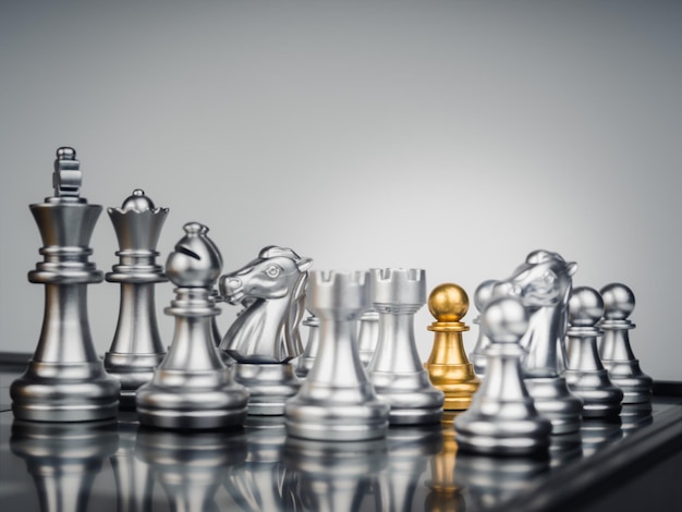 Horizontal shot of cool silver chess pieces in the starting position  reflected on the board Stock Photo by wirestock