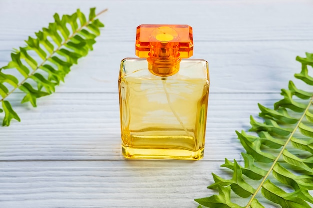 golden perfume bottle on a white table