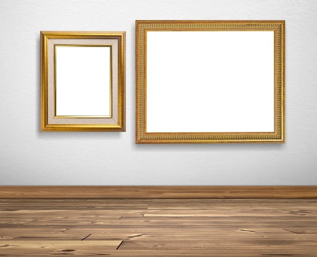 Golden picture frame on white walls and wooden floors