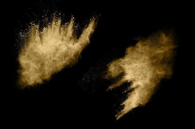 Golden powder explosion on black.  