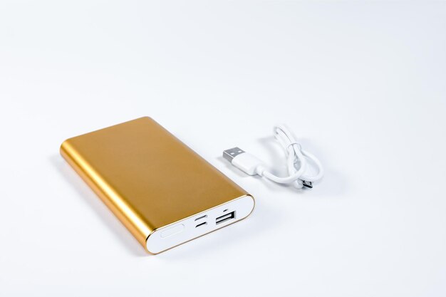 Golden powerbank on a white background