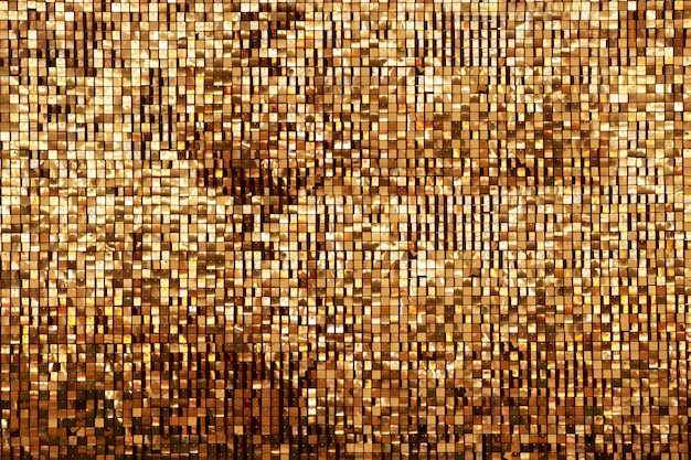 Golden rainbow background from small squares Iridescent golden glass texture background