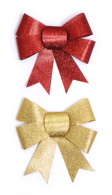 Golden and red bows on white