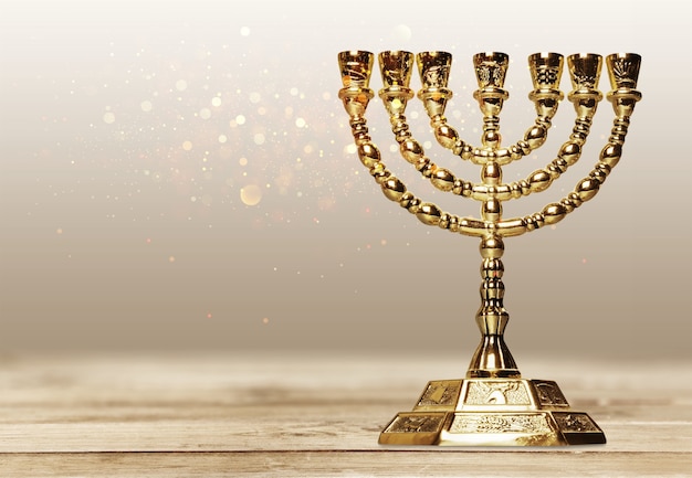 Golden religious menorah isolated on white