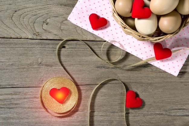 golden ribbon with egg and heartshaped