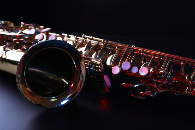 Golden saxophone on dark background