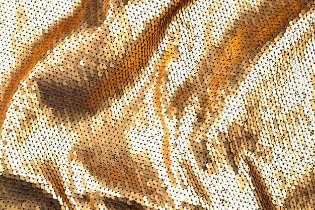 Golden sequins fabric texture.