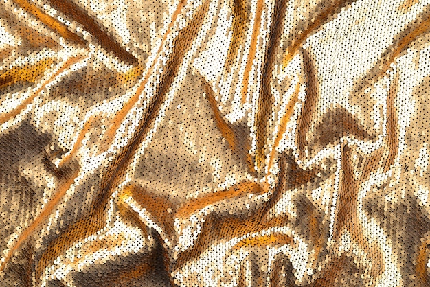 Golden sequins fabric texture.