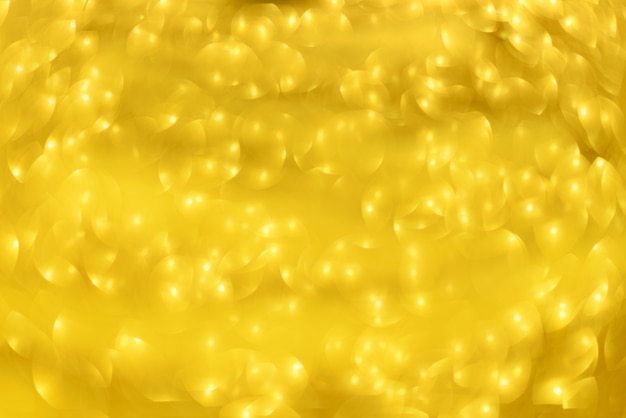 Golden shiny background, copy space for your Christmas greetings. 