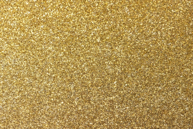 黄金の光沢のある背景。設計のための新年の明るいイエロー ゴールドの抽象的な背景