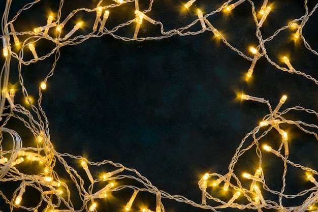 golden shiny christmas lights on dark background