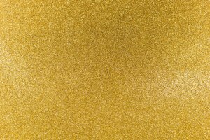 Priorità bassa dell'estratto di natale di struttura di scintillio dell'oro lucido dorato.