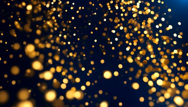 Golden shiny particles on a dark blue background for the design of New Year and Christmas greetings