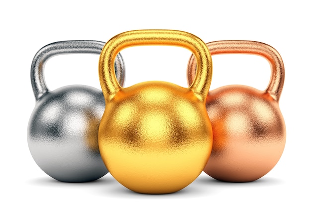 Golden, silver and bronze kettle bells isolated on white background.