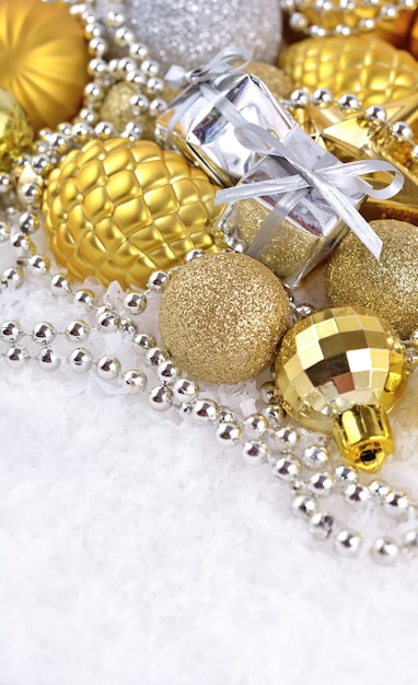 Photo golden and silver christmas decorations on a white background