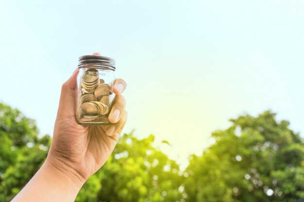 Photo golden and silver coin with closed bottle.